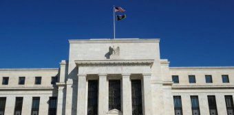 Fed Holds Rates Steady, Signals Potential for Future Cuts
