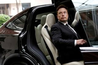 Elon Musk in Beijing, raising hopes of Tesla’s autonomous driving push